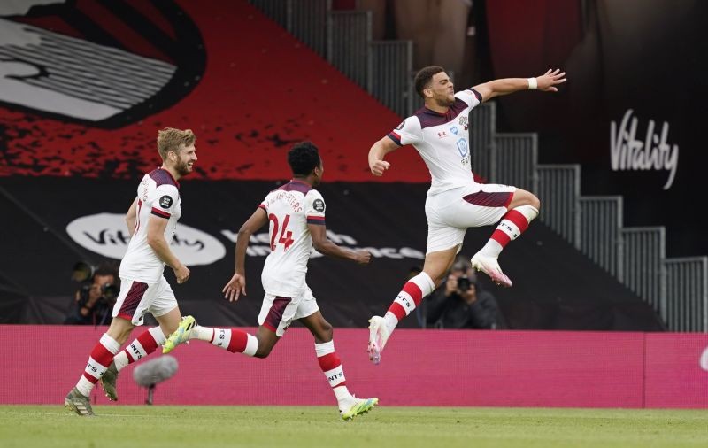 Soccer Football - Premier League - AFC Bournemouth v Southampton - Vitality Stadium, Bournemouth, Britain - July 19, 2020 Southampton's Che Adams celebrates scoring their second goal with teammates, as play resumes behind closed doors following the outbreak of the coronavirus disease (COVID-19) Pool via REUTERS/Will Oliver