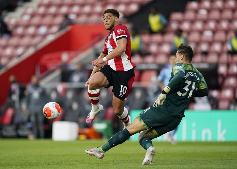 Manchester City's Ederson clears from Southampton's Che Adams, as play resumes behind closed doors following the outbreak of the coronavirus disease (COVID-19) Will Oliver/Pool via REUTERS