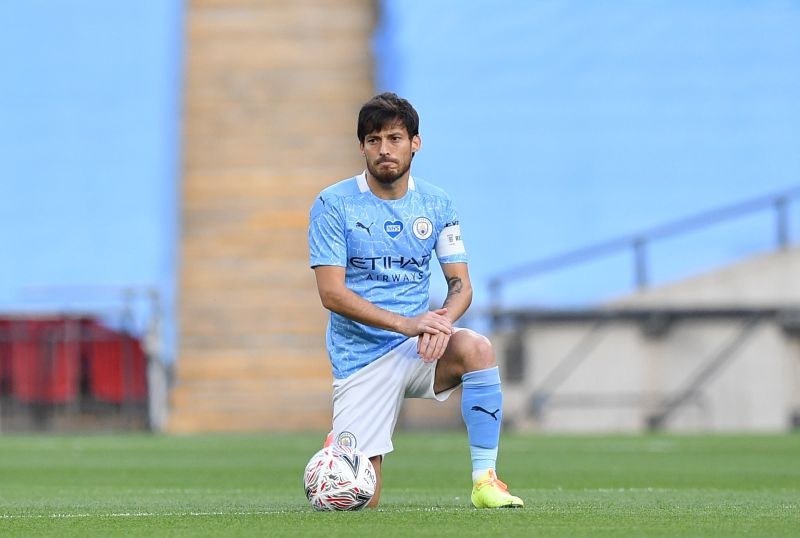 Manchester City's David Silva kneels in support of the Black Lives Matter campaign before the match, as play resumes behind closed doors following the outbreak of the coronavirus disease (COVID-19) Justin Tallis/Pool via REUTERS/File Photo