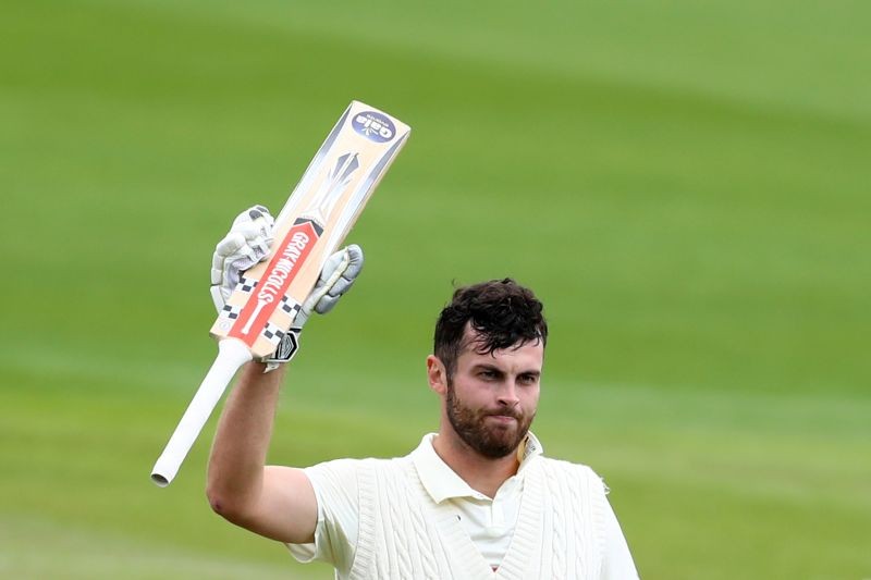 England's Dom Sibley celebrates his century, as play resumes behind closed doors following the outbreak of the coronavirus disease (COVID-19) Michael Steele/Pool via REUTERS