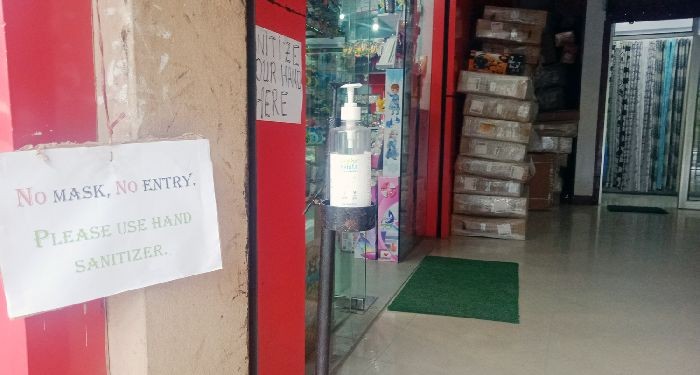 Signage in front of a shop in Kohima informing customers to wear face masks. (Morung Photo)