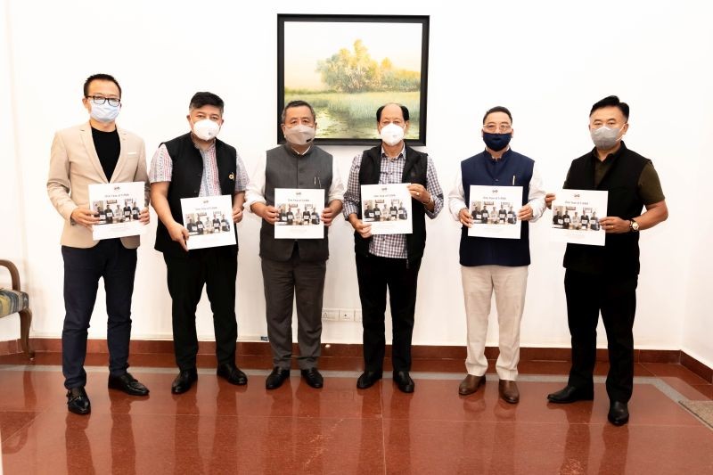 Chief minister Nepihiu Rio and others during the release of TaFMA one year report at CM residential office, Kohima on July 25.