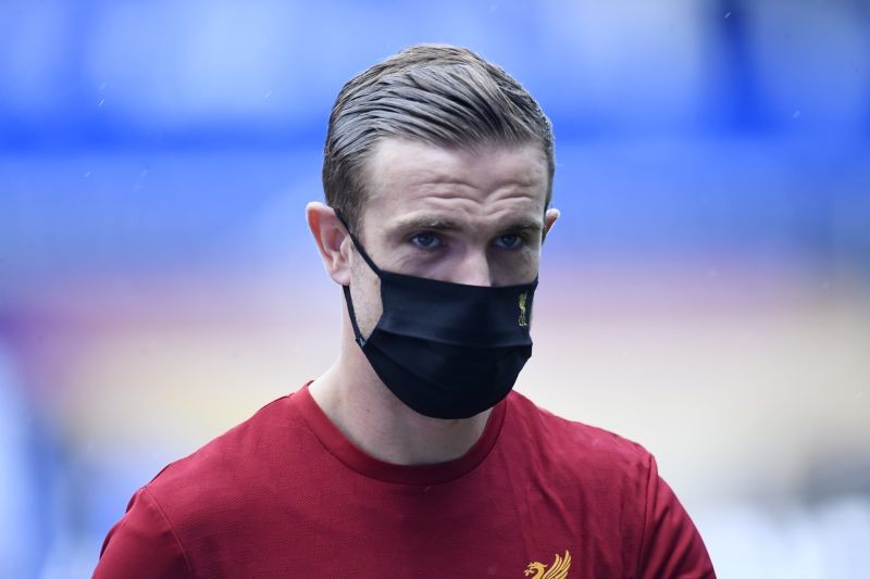 Liverpool's Jordan Henderson wearing a mask on the pitch before the match, as play resumes behind closed doors following the outbreak of the coronavirus disease (COVID-19) Peter Powell/Pool via REUTERS