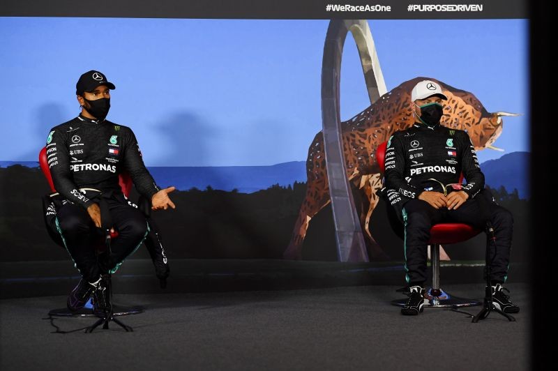 Mercedes' Valtteri Bottas and Lewis Hamilton wearing protective face masks during the press conference after qualifying, as F1 resumes following the outbreak of the coronavirus disease (COVID-19) Mario Renzi/Pool via REUTERS