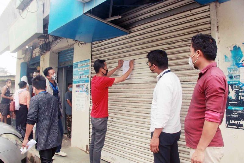 Ao Kaketshir Mungdang sealing the shutters of the office of a telecom service provider in Mokokchung town on July 4. (Morung Photo)