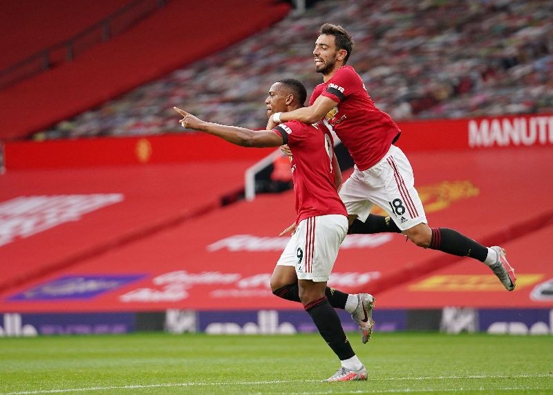 Soccer Football - Premier League - Manchester United v Southampton - Old Trafford, Manchester, Britain - July 13, 2020 Manchester United's  Anthony Martial scores their second goal, as play resumes behind closed doors following the outbreak of the coronavirus disease (COVID-19) Pool via REUTERS/Dave Thompson