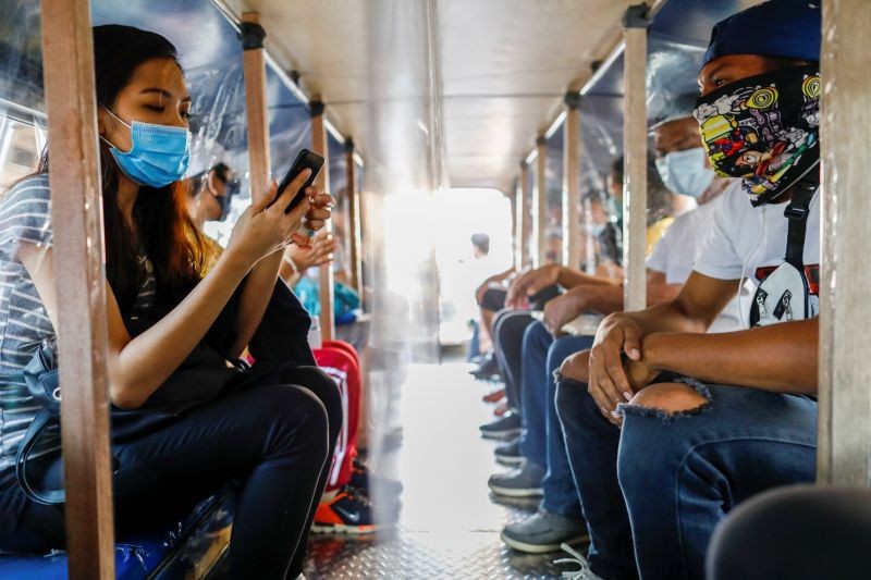 Passengers wearing masks for protection against the coronavirus disease (COVID-19) are seated in between plastic barriers to maintain social distancing in a jeepney, in Quezon City, Metro Manila, Philippines on July 3. (REUTERS Photo)