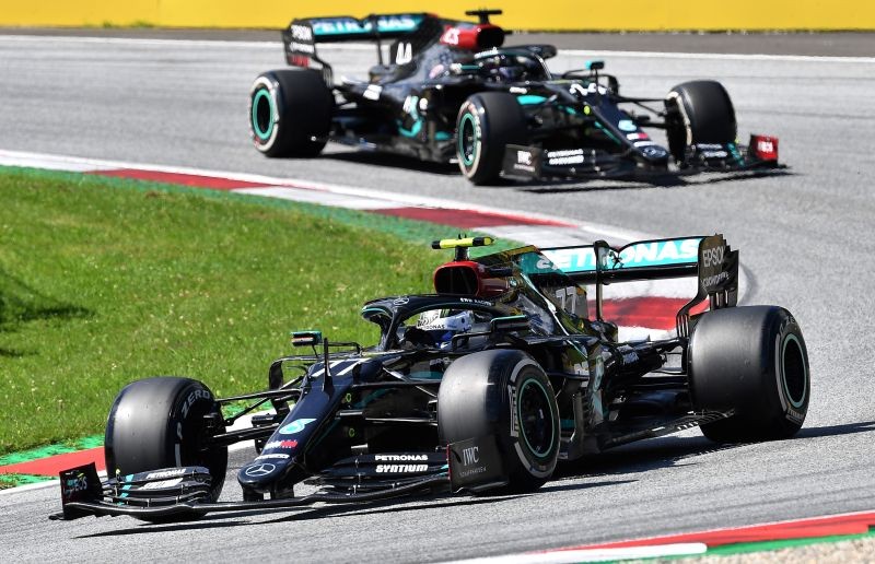 Mercedes' Valtteri Bottas leads Mercedes' Lewis Hamilton during the race, as F1 resumes following the outbreak of the coronavirus disease (COVID-19) Joe Klamar/Pool via REUTERS