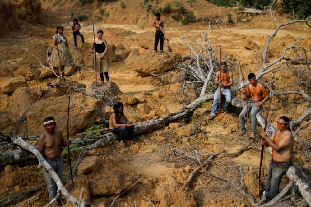 Indigenous people from the Mura tribe show a deforested area in unmarked indigenous lands inside the Amazon rainforest near Humaita, Amazonas State, Brazil August 20, 2019. REUTERS/Ueslei Marcelino