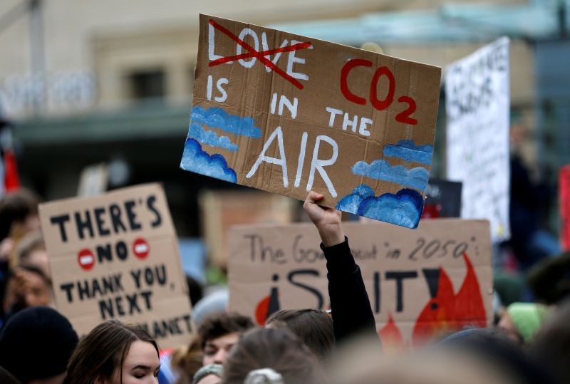 A climate change activist holds a sign during a demonstration of the Fridays for Future movement in Lausanne, Switzerland on January 17, 2020. (REUTERS File Photo)