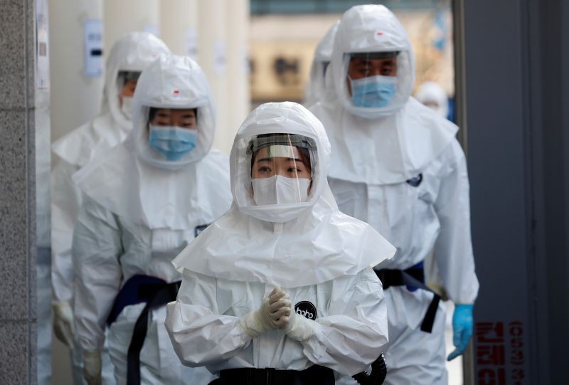 Medical workers in protective gears walk into a hospital facility to treat coronavirus patients amid the rise in confirmed cases of coronavirus disease (COVID-19) in Daegu, South Korea on March 8, 2020. (REUTERS File Photo)