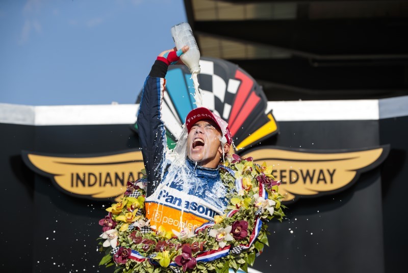 IndyCar Series driver Takuma Sato celebrates with the milk after winning the 104th Running of the Indianapolis 500 at Indianapolis Motor Speedway. Mandatory Credit: Mark J. Rebilas-USA TODAY Sports