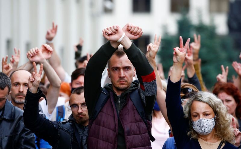 People gesture as they take part in a rally against presidential election results near the Ministry of Education in Minsk, Belarus on August 25, 2020. (REUTERS Photo)