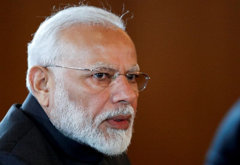 Indian Prime Minister Narendra Modi speaks to Russian President Vladimir Putin during their meeting on the sideline of the 11th edition of the BRICS Summit, in Brasilia, Brazil November 13, 2019. Pavel Golovkin/Pool via REUTERS/File Photo