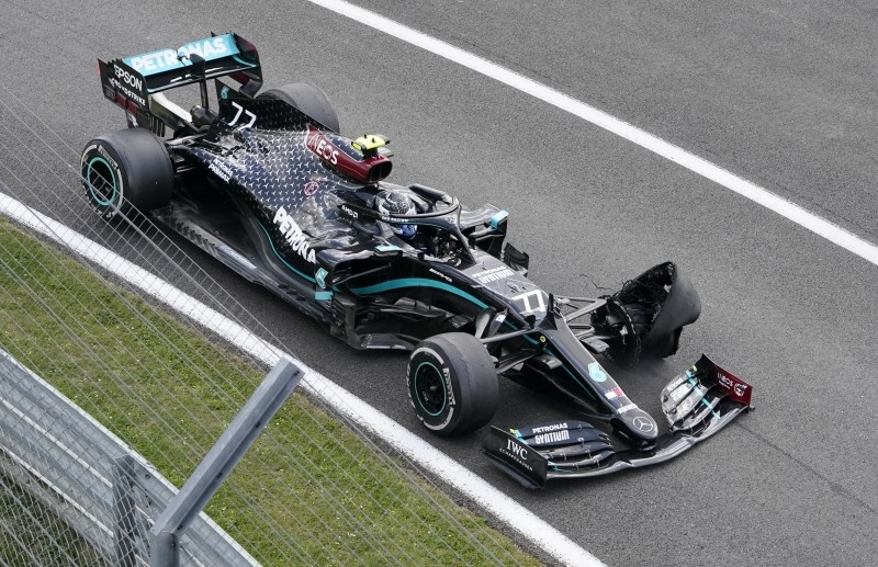 Mercedes' Valtteri Bottas with a puncture during the race Pool via REUTERS/Will Oliver