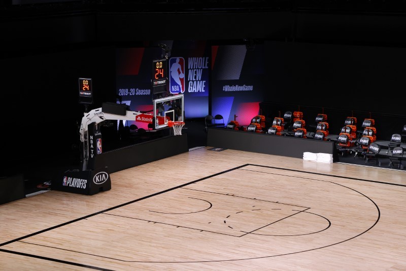 An empty court and bench is shown with no signage following the scheduled start time in Game Five of the Eastern Conference First Round between the Milwaukee Bucks and the Orlando Magic during the 2020 NBA Playoffs at AdventHealth Arena at ESPN Wide World Of Sports Complex on August 26, 2020 (Reuters Photo)