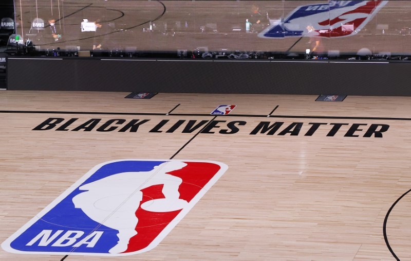 FILE PHOTO: Aug 26, 2020; Lake Buena Vista, Florida, USA; An empty court and bench is shown with no signage following the scheduled start time in Game Five of the Eastern Conference First Round between the Milwaukee Bucks and the Orlando Magic during the 2020 NBA Playoffs at AdventHealth Arena at ESPN Wide World Of Sports Complex on August 26, 2020 in Lake Buena Vista, Florida. Mandatory Credit: Kevin C. Cox/Pool Photo-USA TODAY Sports