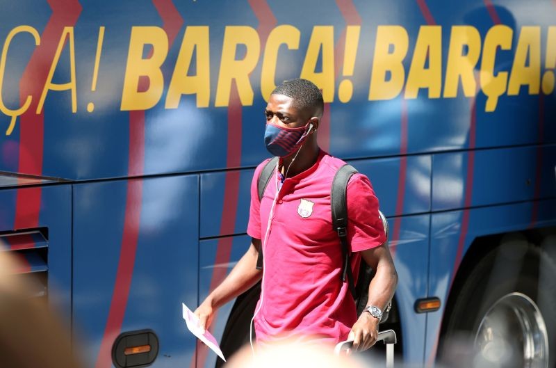 Barcelona's Ousmane Dembele wearing a protective face mask as he arrives at the Sheraton hotel REUTERS/Rafael Marchante
