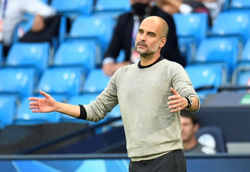 FILE PHOTO: Manchester City manager Pep Guardiola reacts, as play resumes behind closed doors following the outbreak of the coronavirus disease (COVID-19) Pool via REUTERS/Peter Powell/File Photo
