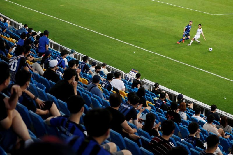 Fans watch the match, as the match resumes with fans for the first time since the outbreak of coronavirus disease (COVID-19) REUTERS/Kim Hong-Ji