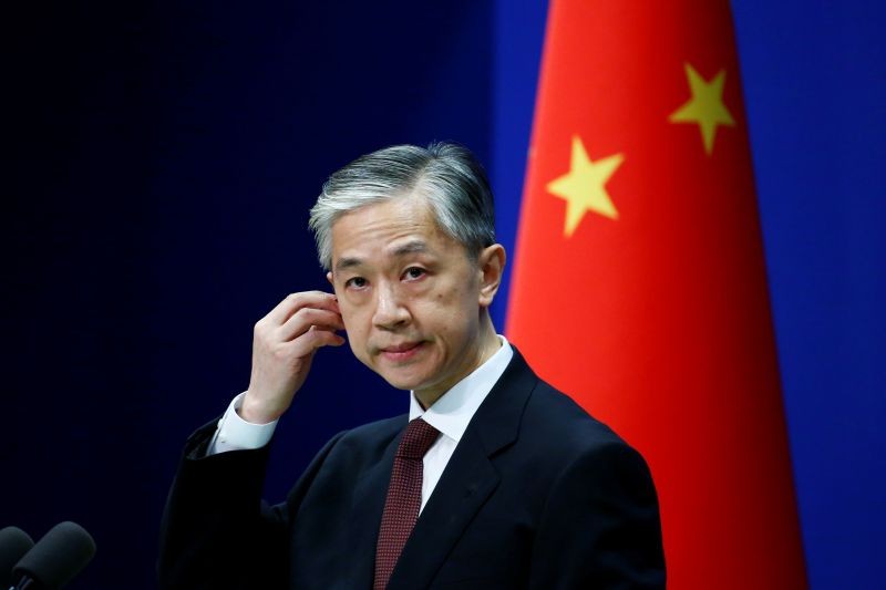 Chinese Foreign Ministry spokesman Wang Wenbin listens to a question from a journalist during a news conference in Beijing, China on July 27, 2020. (REUTERS File Photo)