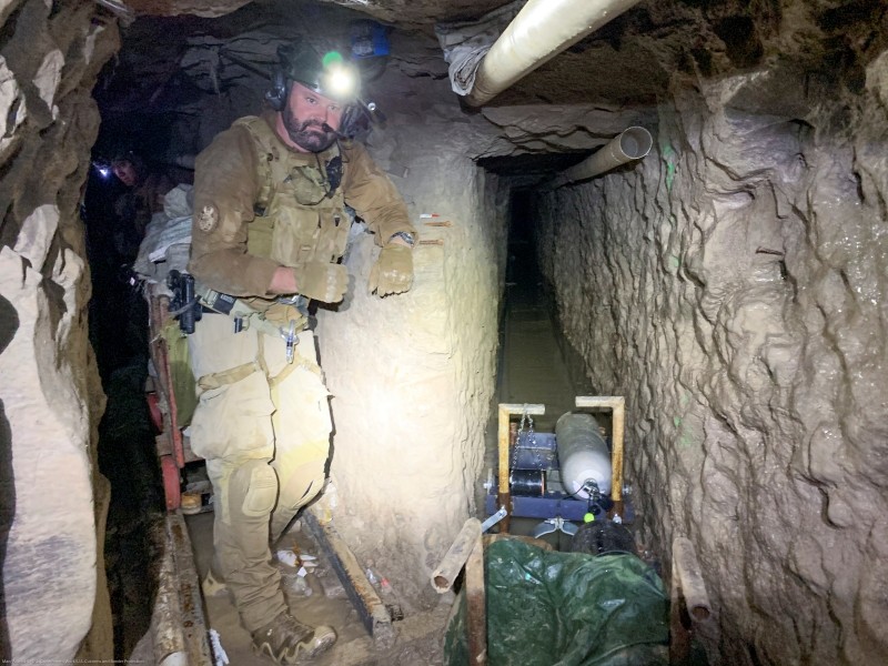 A U.S. Customs and Border Protection (CBP) agent stands by for security at a tunnel spur that went off into a different direction, during mapping of the "Baja Metro Tunnel", which CBP says is the longest illicit cross-border tunnel ever discovered along the Southwest border, in Otay Mesa, California, U.S. November 13, 2019. Picture taken November 13, 2019. U.S. Customs and Border Protection/Handout via REUTERS.