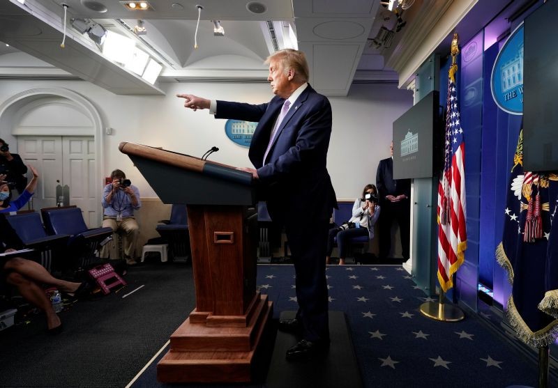 U.S. President Donald Trump points to a reporter as he holds a coronavirus disease (COVID-19) pandemic briefing in the Brady Press Briefing Room of the White House in Washington, US on August 5, 2020. (REUTERS Photo)