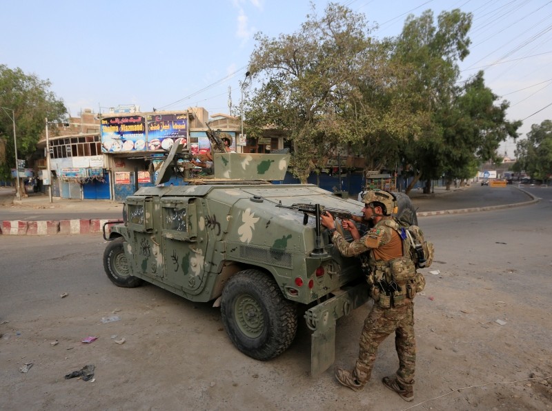 Afghan security forces keep watch near the site of an attack on a jail compound in Jalalabad, Afghanistan, August 3, 2020.REUTERS/Parwiz