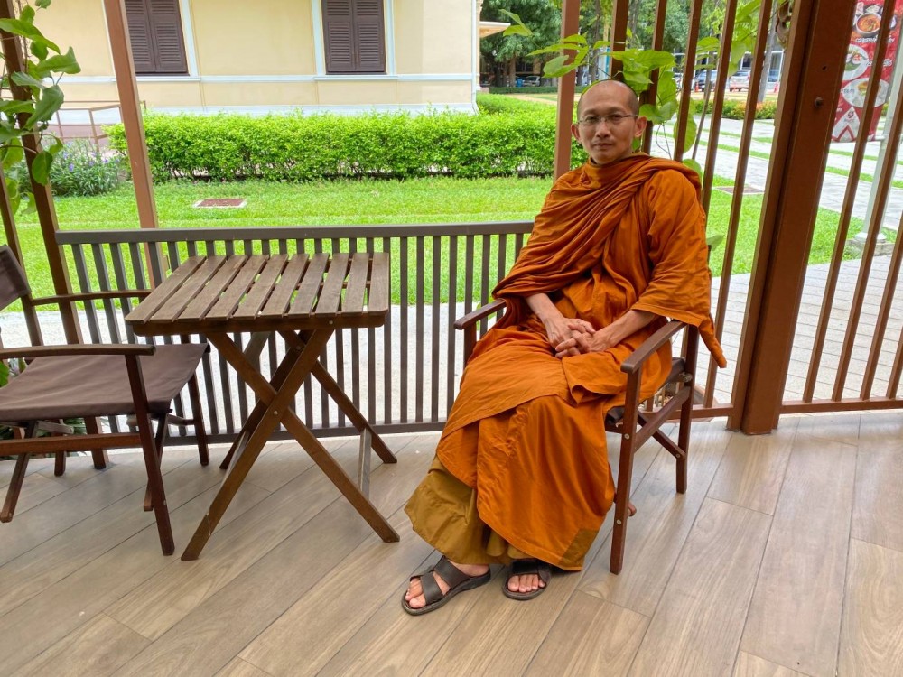 Shine Waradhammo, a Buddhist monk, poses for a photograph in Bangkok, Thailand, August 9, 2020. Thomson Reuters Foundation/Rina Chandran