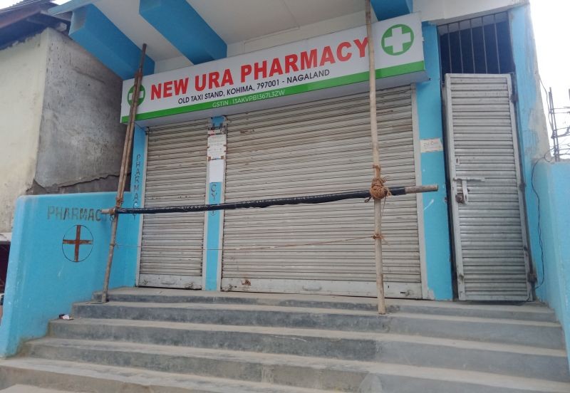 A pharmacy in the state capital seen with its shutters down after NIDA called for a 24-hour statewide total shutdown of all medical services on August 26. (Morung Photo)