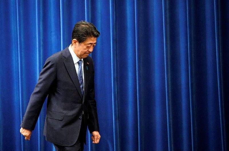 Japanese Prime Minister Shinzo Abe walks after delivering a news conference at the prime minister's official residence in Tokyo, Japan, August 28, 2020. Franck Robichon/Pool via REUTERS