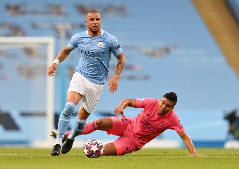 Manchester City's Kyle Walker in action with Real Madrid's Casemiro, as play resumes behind closed doors following the outbreak of the coronavirus disease (COVID-19) Pool via REUTERS/Shaun Botterill