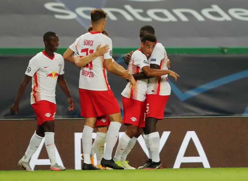 RB Leipzig's Tyler Adams celebrates scoring their second goal with teammates, as play resumes behind closed doors following the outbreak of the coronavirus disease (COVID-19) Miguel A. Lopes/Pool via REUTERS