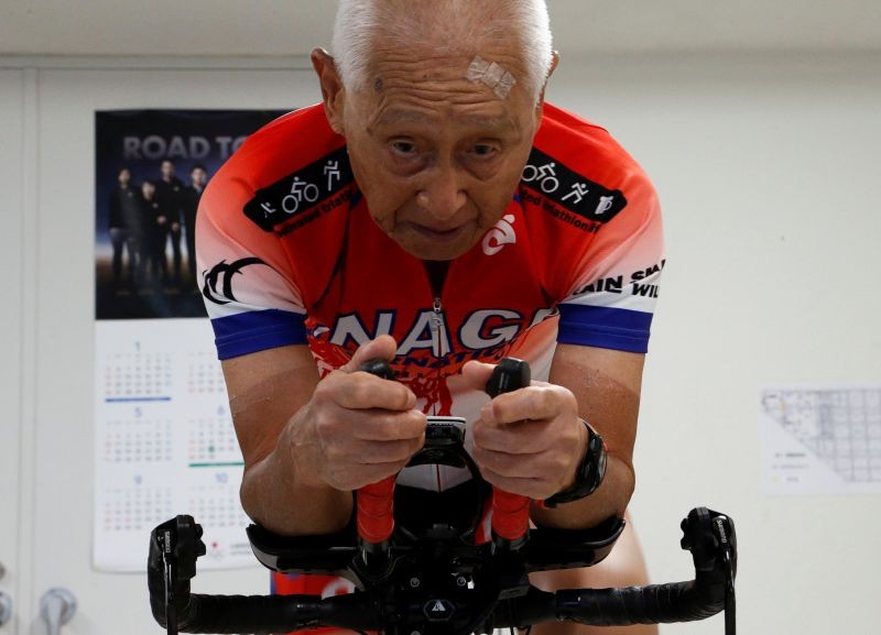 Hiromu Inada, redord holder of the oldest person to complete an Ironman World Championship, works out on his bike at his training facility in Chiba, near Tokyo, Japan August 26, 2020. Picture taken August 26, 2020. REUTERS/Jack Tarrant