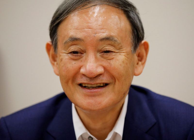 Japan's top government spokesman Chief Cabinet Secretary Yoshihide Suga smiles during an interview with Reuters in Tokyo, Japan on August 26, 2020. (REUTERS File Photo)