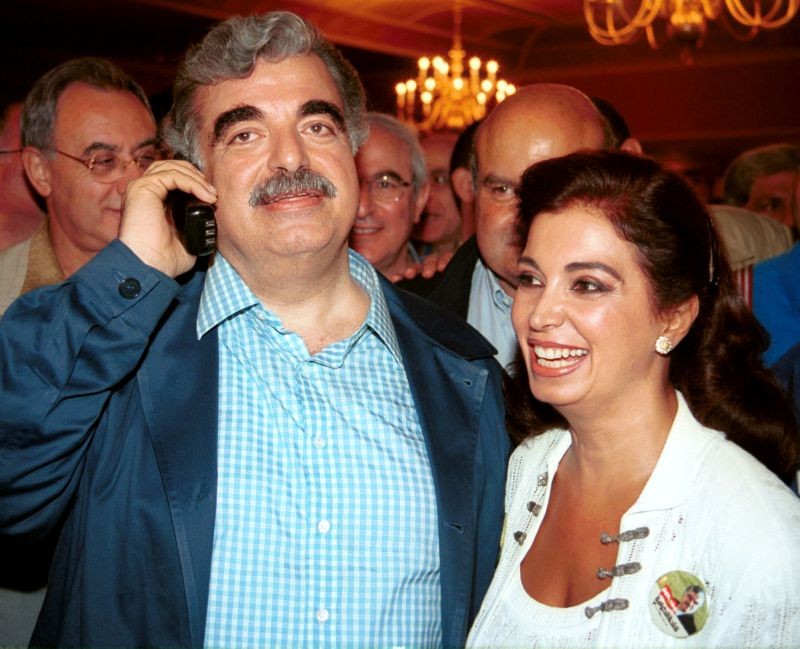 Lebanon's former Prime Minister Rafik al-Hariri, with his wife Nazek, receives congratulations after a late-night broadcast of unofficial parliamentary results in Beirut, Lebanon on September 3, 2000. (REUTERS File Photo)