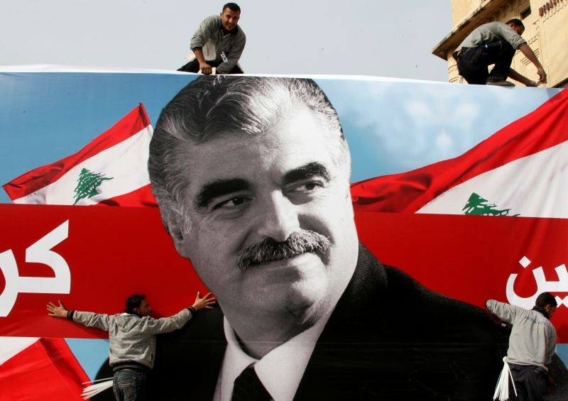 Workers prepare a giant poster depicting Lebanon's assassinated former prime minister Rafik al-Hariri, in downtown Beirut, Lebanon on February 12, 2010. (REUTERS File Photo)