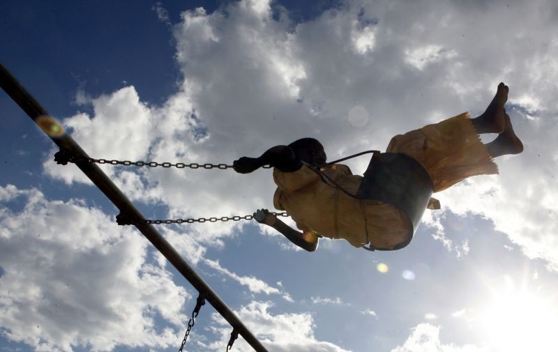 A chlid plays at a school financed by U.S. pop star Madonna in Namitete, some 50km south of Malawi's capital Lilongwe, March 30, 2009. A court in Malawi is expected to rule on Friday whether Madonna can adopt a second child from the southern African country, a move likely to be opposed by human rights groups.Madonna appeared in court on Monday seeking to adopt a four-year-old girl, Mercy James. The case was adjourned until April 3.( REUTERS File Photo)