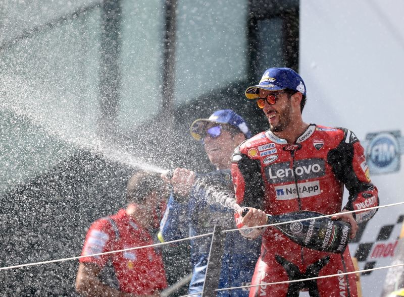 Mission Winnow Ducati Corse's Andrea Dovizioso celebrates winning the race on the podium REUTERS/Lisi Niesner