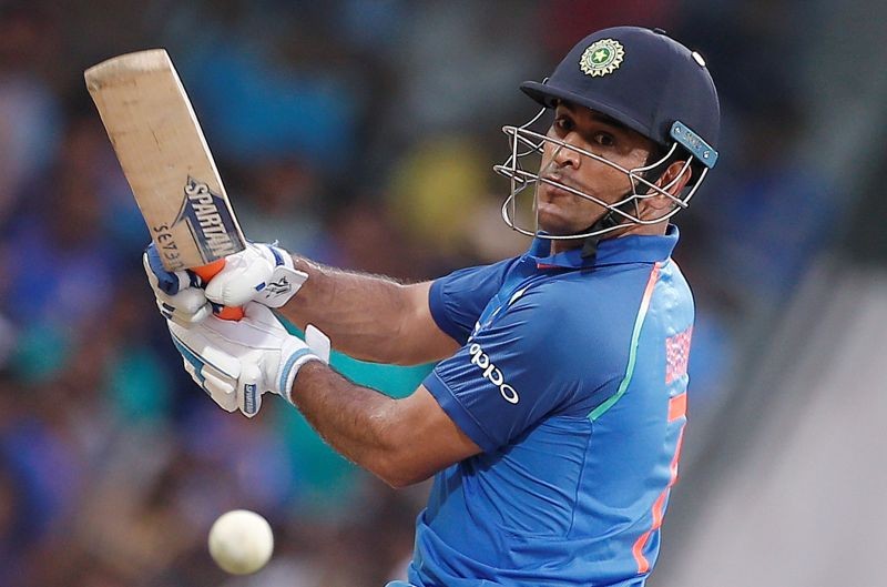 FILE PHOTO: India's Mahendra Singh Dhoni plays a shot. REUTERS/Adnan Abidi/File photo