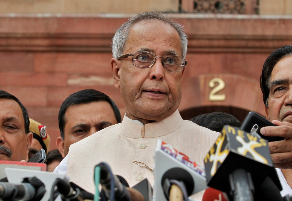 FILE PHOTO: Pranab Mukherjee speaks to media in the run-up to the Indian presidential election in New Delhi June 26, 2012. (REUTERS/Adnan Abidi/File Photo)