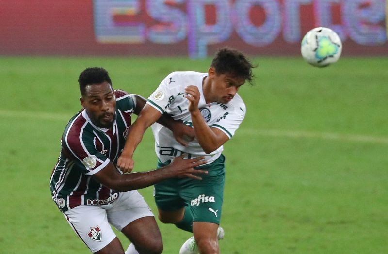 Palmeiras' Gustavo Scarpa in action with Fluminense's Luccas Claro, following the resumption of play behind closed doors after the outbreak of the coronavirus disease (COVID-19) REUTERS/Pilar Olivares