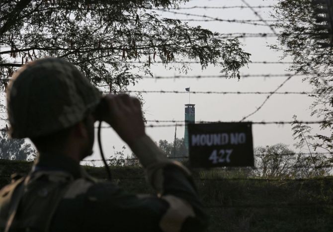An BSF personnel during patrol along the fenced border with Pakistan in RS Pura sector near Jammu. Image used only for representation. Photograph: Mukesh Gupta/Reuters
