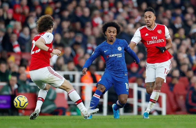 FILE PHOTO: Soccer Football - Premier League - Arsenal v Chelsea - Emirates Stadium, London, Britain - December 29, 2019 Chelsea's Willian in action with Arsenal's David Luiz and Pierre-Emerick Aubameyang  Action Images via Reuters/Matthew Childs