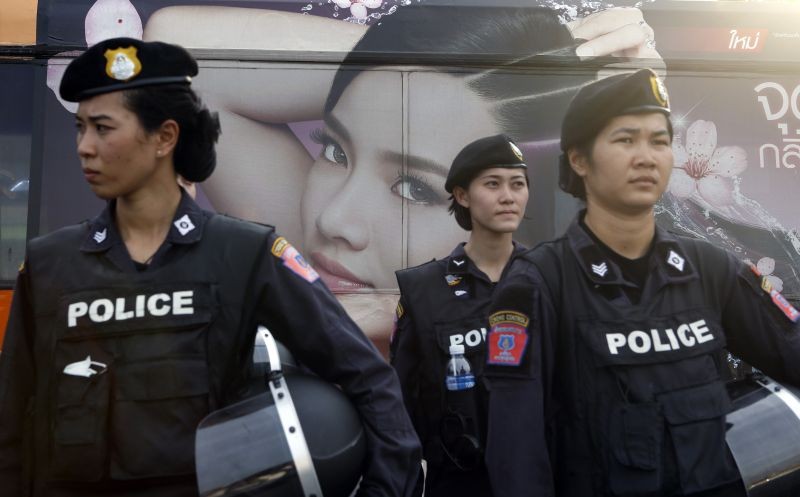 A beauty product advertisement on a passing bus is seen as Thai female riot police take positions to prevent demonstrations against military rule at Victory Monument in Bangkok June 3, 2014. The military junta running Thailand has drawn up a list of emergency measures such as price caps on fuel and loan guarantees for small firms to kick-start an economy threatened by recession after months of political turmoil. (REUTERS File Photo)