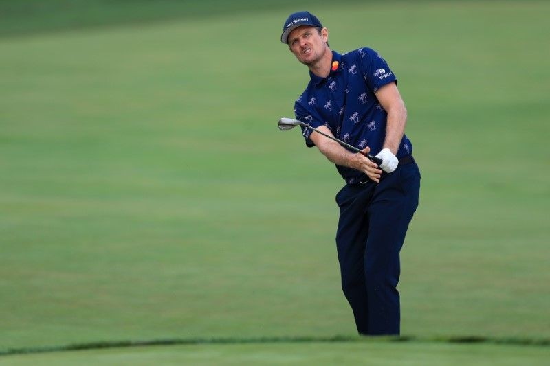 FILE PHOTO: Justin Rose chips onto the 13th green during the second round of The Memorial Tournament at Muirfield Village Golf Club. Mandatory Credit: Aaron Doster-USA TODAY Sports/File photo