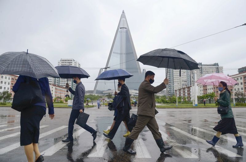 People wearing protective face masks walk amid concerns over the new coronavirus disease (COVID-19) in Pyongyang, North Korea May 15, 2020, in this photo released by Kyodo. (REUTERS File Photo)