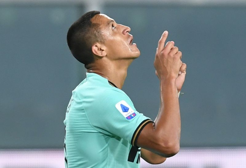 FILE PHOTO: Inter Milan's Alexis Sanchez celebrates scoring their second goal, as play resumes behind closed doors following the outbreak of the coronavirus disease (COVID-19) REUTERS/Jennifer Lorenzini/File Photo