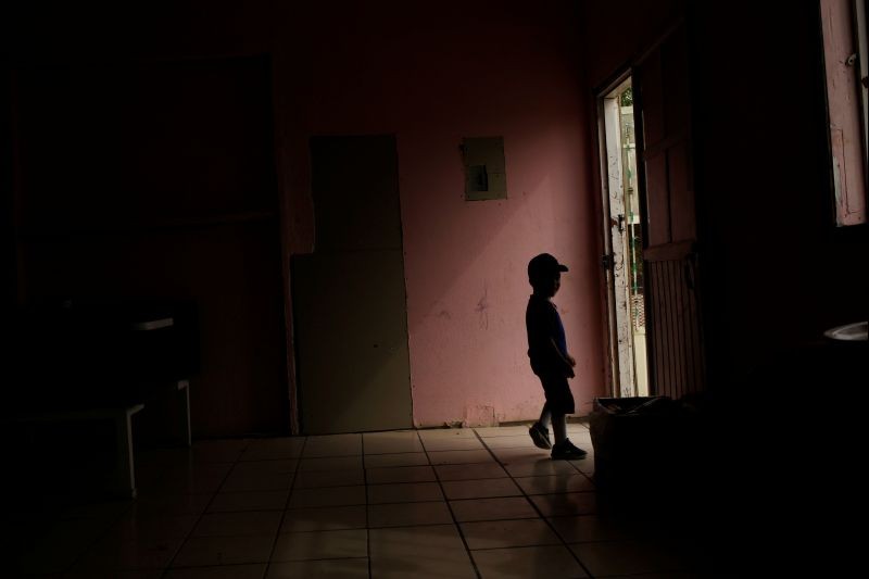 A Central American migrant child, asylum seeker sent back to Mexico from the U.S. under Migrant Protection Protocols (MPP) along his parents, is silhouetted at the Pan de Vida migrant shelter at Anapra neighborhood, in Ciudad Juarez, Mexico on September 13, 2019. (REUTERS File Photo)