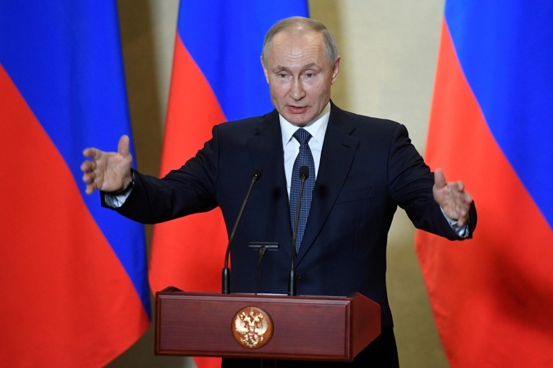 FILE PHOTO: Russian President Vladimir Putin delivers a speech during a ceremony, which awards constructors of the Crimean Bridge over the Kerch Strait, in Sevastopol, Crimea March 18, 2020. Alexander Nemenov/Pool via REUTERS